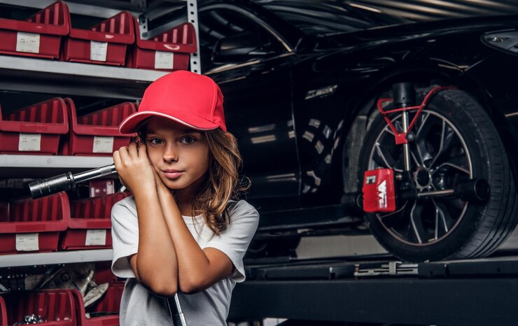 shelf-with-tools-shiny-car-little-girl-hat-with-big-wrench-hands_613910-17048